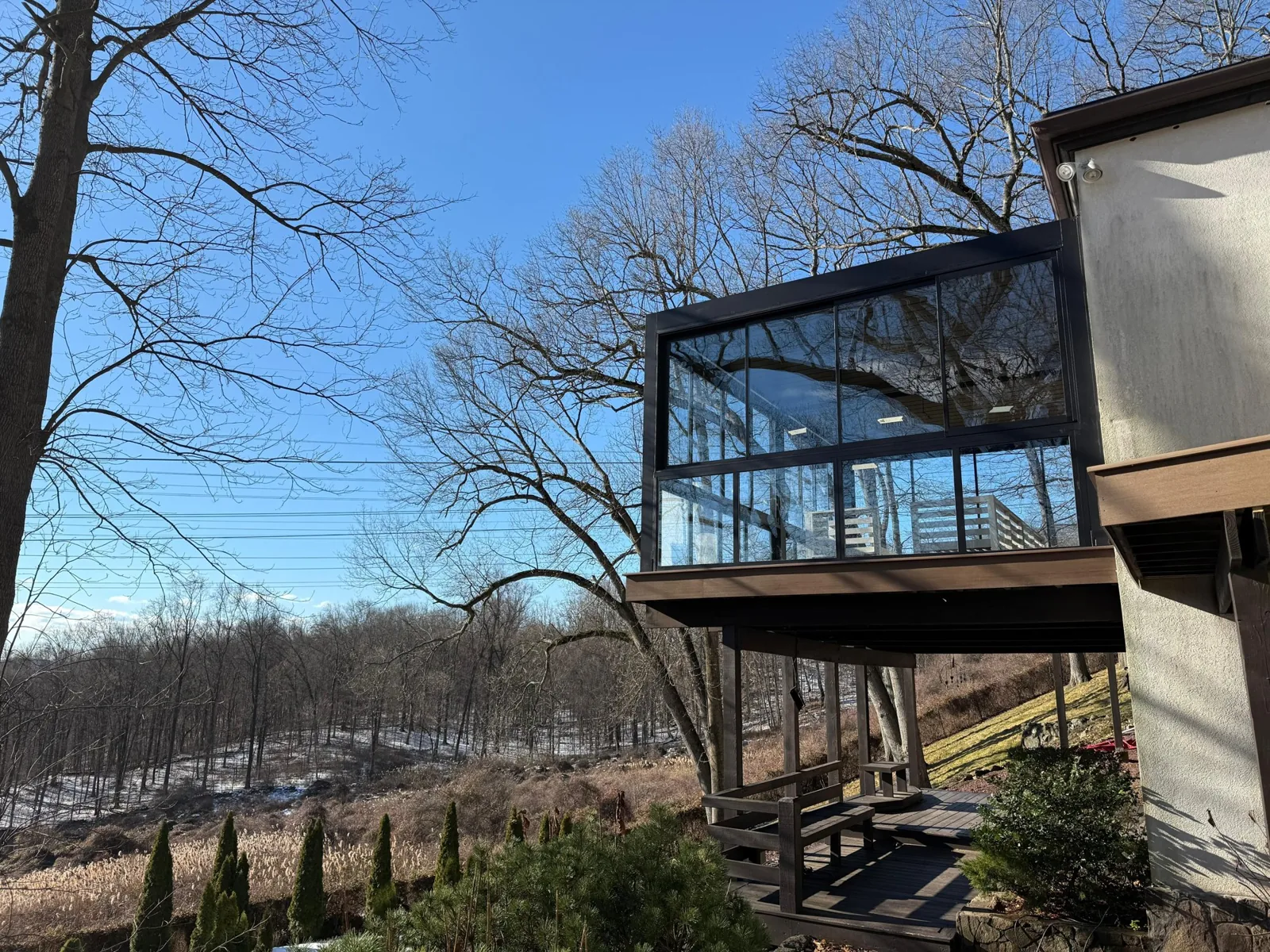 Glass enclosure on an elevated deck in Croton-on-Hudson, New York